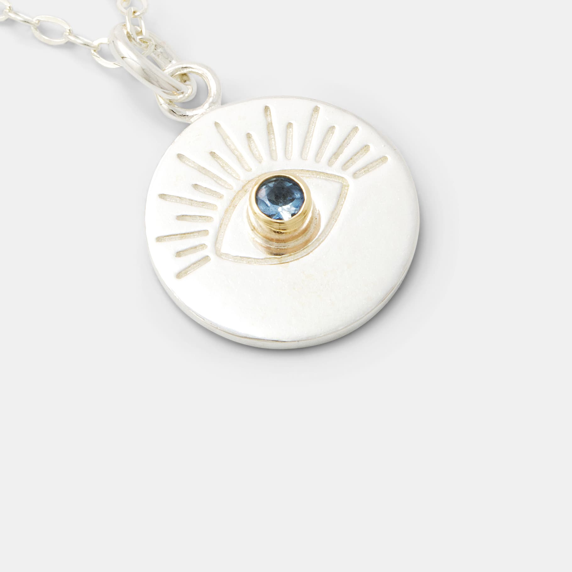 March birthstone jewellery: sterling silver and solid gold eye amulet necklace with aquamarine gem